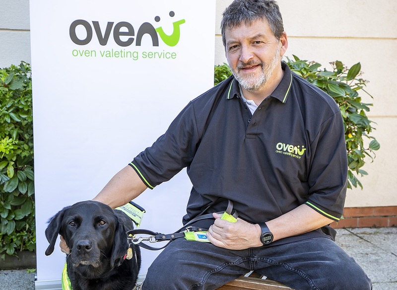 Rob Sansom of Ovenu Nottingham North pictured with guide dog Yoko