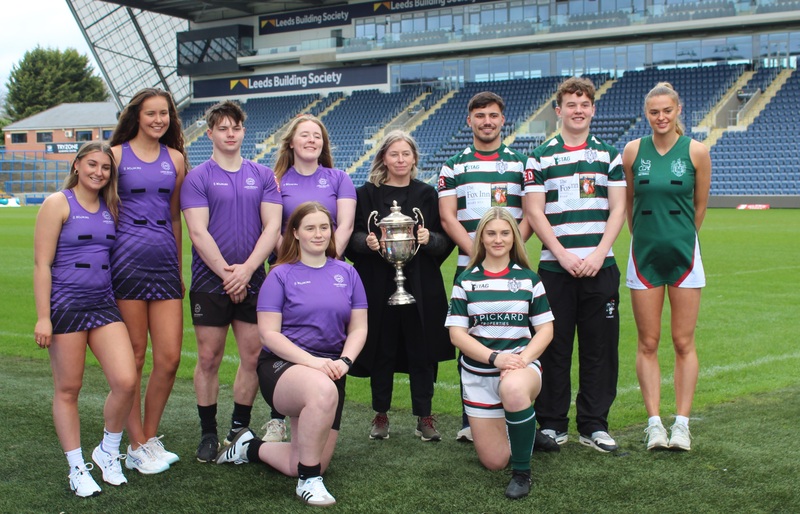 Denise McArdle, centre, with the Varsity trophy that will be fought over by Leeds Beckett University and University of Leeds