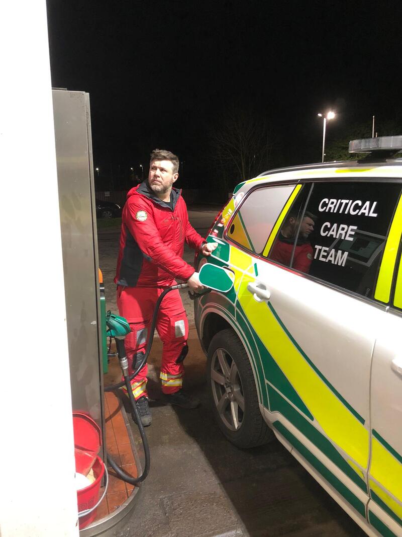 GNAAS paramedic Marcus filling the car with fuel