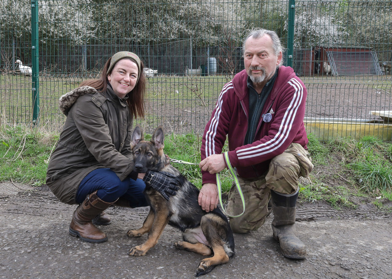 (left) Emma Thompson, Housing Administrator at Beyond Housing, pictured with Hope Animal Shelter founder Cliff Spedding and unwanted Christmas puppy Holly.