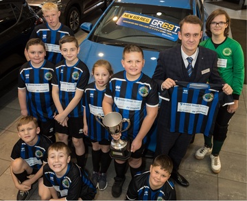 Martin Chauntry, business manager at Renault and Dacia Mansfield, with the Sherwood Colliery Ability Counts Juniors FC team