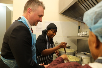 Simon Blackwell, general manager, with soup kitchen volunteer, Gayon Barnett.