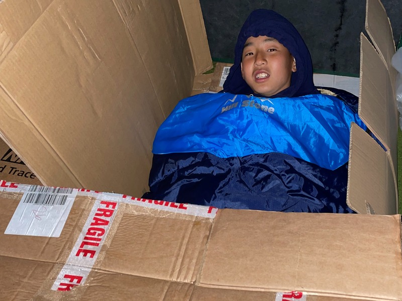 Atsushi Yamaguchi, 11, in his homemade shelter