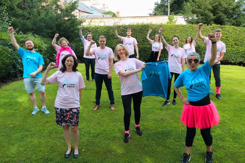 Centre, Partner Nicola Bellerby with colleagues from the Clive Owen Race for Life team