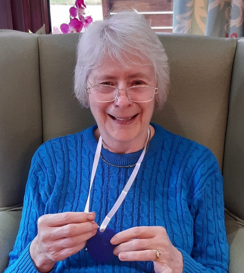A Magnolia House resident with her medal