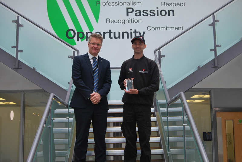 CEO Robert Forrester presents Terry Mason with his award