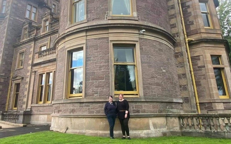 Left to right Celia Peat with Vicky Miller outside Deanston House 