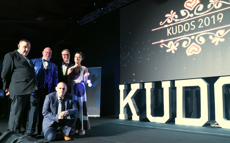 Colin Welding and John Godden (centre left and right) with individuals supported by Salutem at the 2019 Kudos Ball