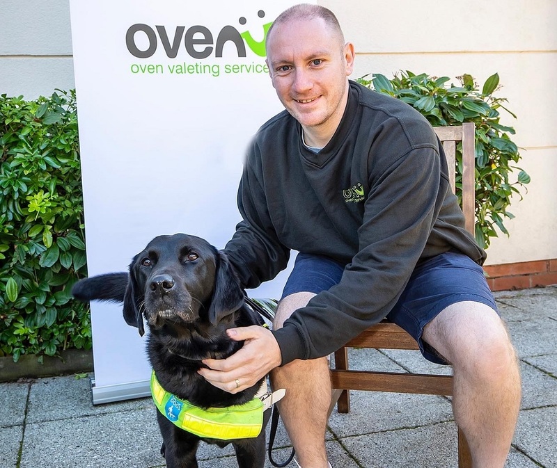 Rob Burkitt of Ovenu Newton Abbot with guide dog Yoko