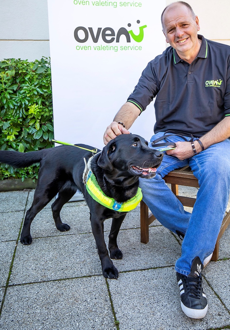 Dave Simmonds of Ovenu Rugby with guide dog Yoko