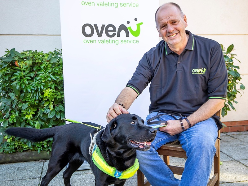 Dave Simmonds of Ovenu Rugby with guide dog Yoko