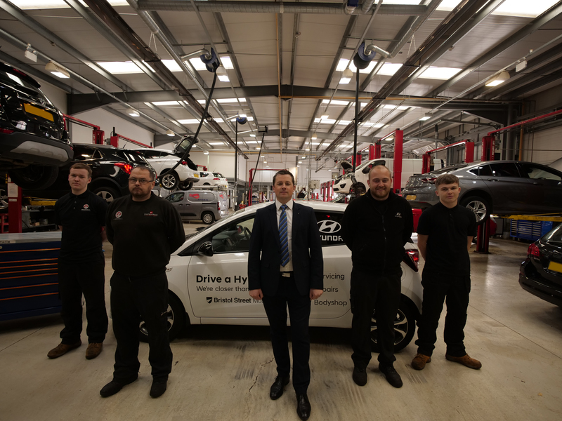 Liam Fenwick, General Manager at Bristol Street Motors Vauxhall Newcastle (centre) with some of the technician team