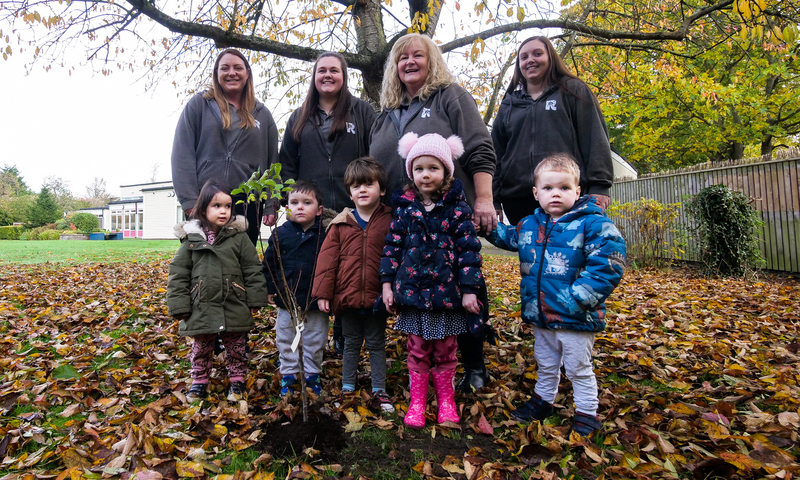 Staff and children at Egglescliffe Rosedene with the new tree