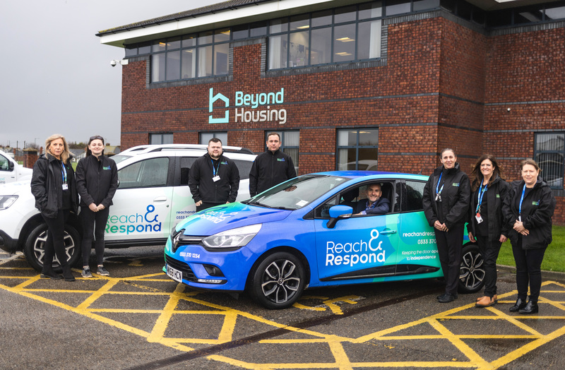 Jason Lowe, Beyond Housing Head of Independent and Supported Living (in car) celebrates the Redcar launch of Reach and Respond with colleagues.