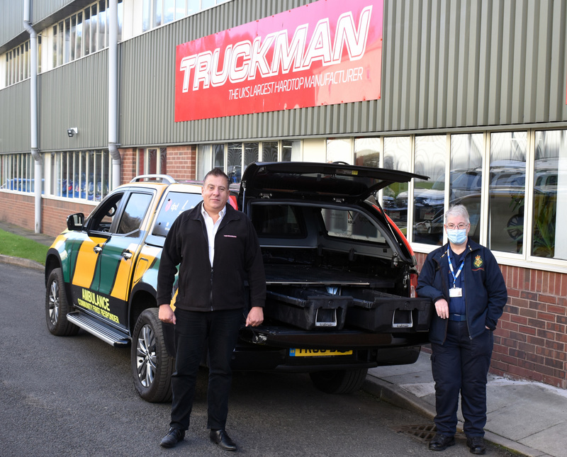 Truckman Sales Manager Mark Stidston (left) and SSFR Group Co-Ordinator Jean Morgan (right) with the SSFR pick-up truck fitted with DECKED