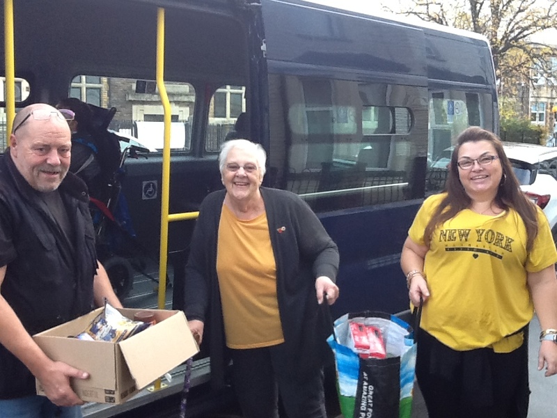 Staff dropping off food at the foodbank
