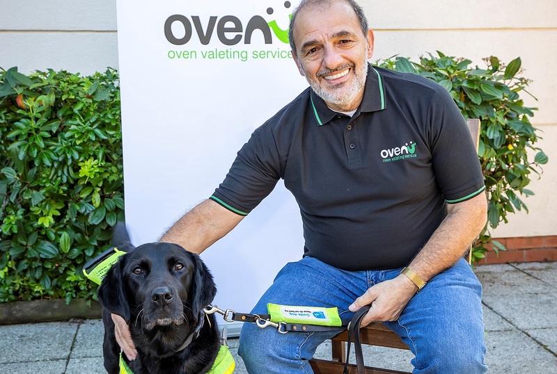 Mike Korniotis of Ovenu Cambridge with guide dog Yoko