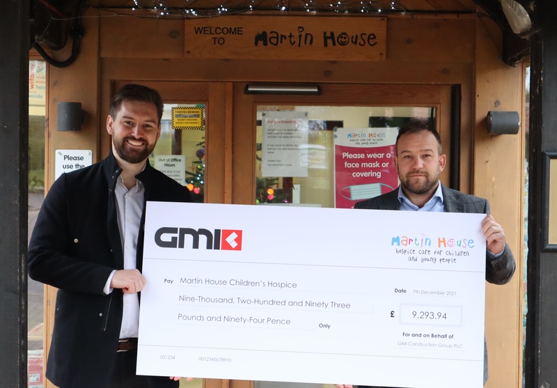L-R: Gavin Draper is presented with the cheque for £9,293 by Martin Watson, Construction Director at GMI Construction Group