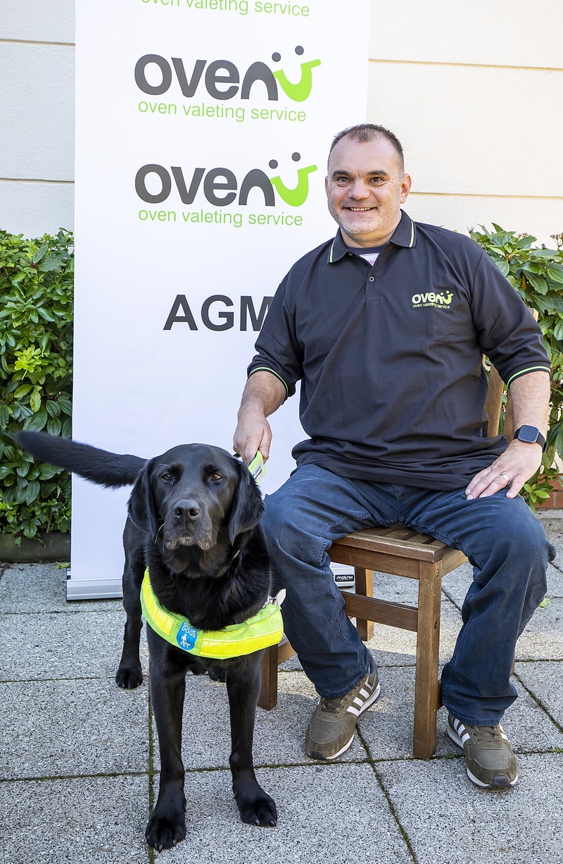 Giles Layton of Ovenu Eastleigh pictured with guide dog Yoko