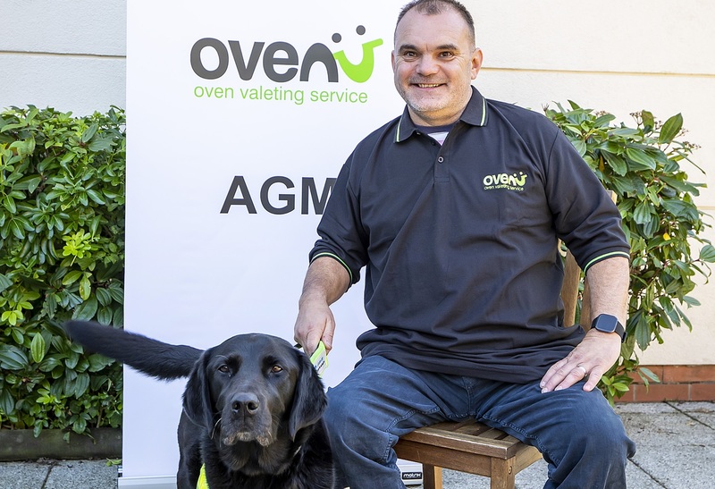 Giles Layton of Ovenu Eastleigh pictured with guide dog Yoko