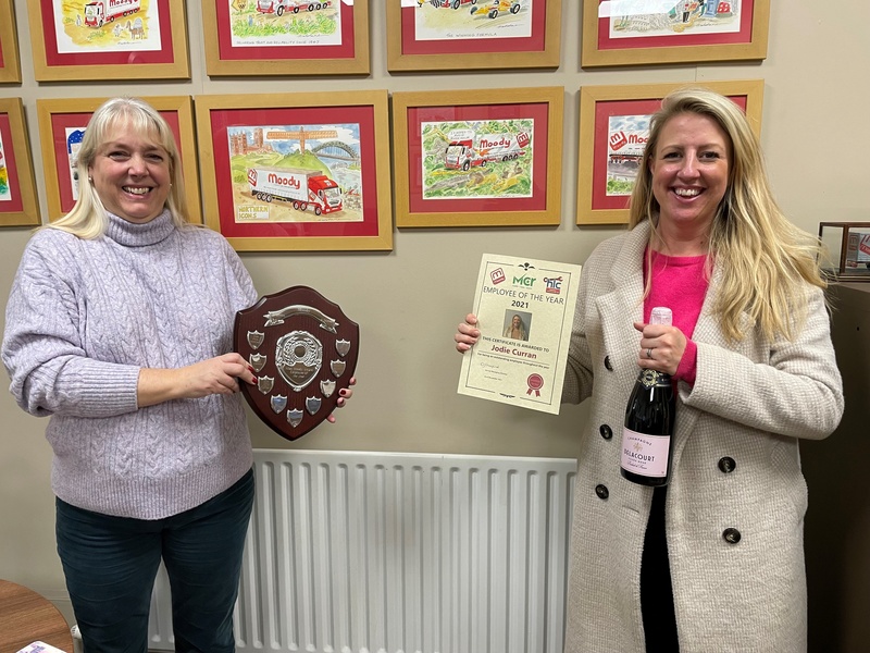 Managing director Caroline Moody (left) presents Jodie Curran with her Employee of the Year award