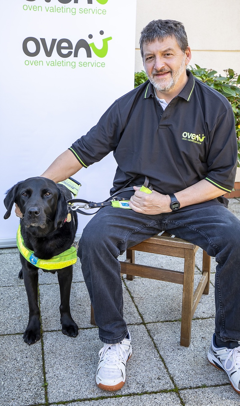 Rob Sansom of Ovenu Nottingham North pictured with guide dog Yoko