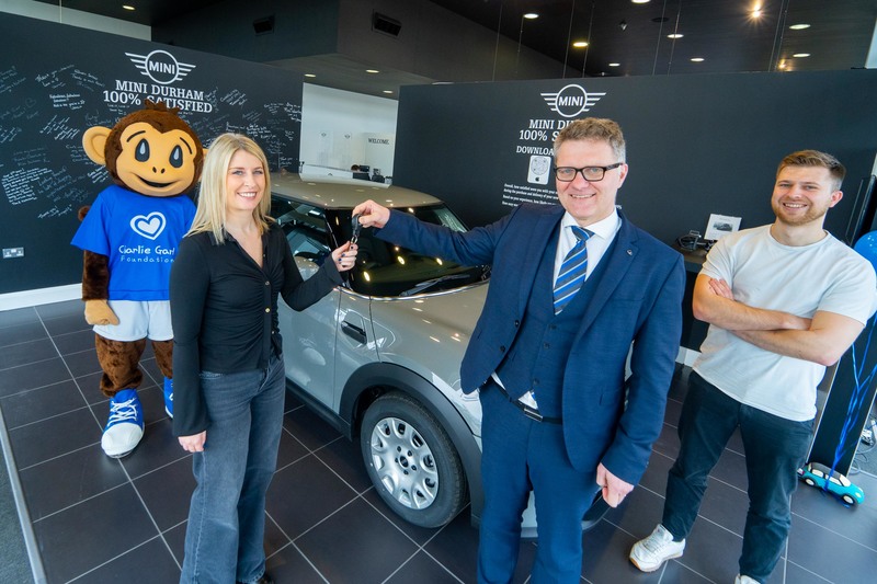 Winner Emily Taylor, Robert Forrester, Chief Executive of Vertu Motors, Jordan Proctor from Charity Escapes