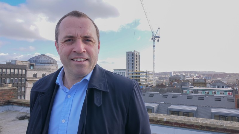 Chris Donabie, Partner at Naylors Gavin Black on the roof of Grainger Chambers with Pilgrim Street in the background