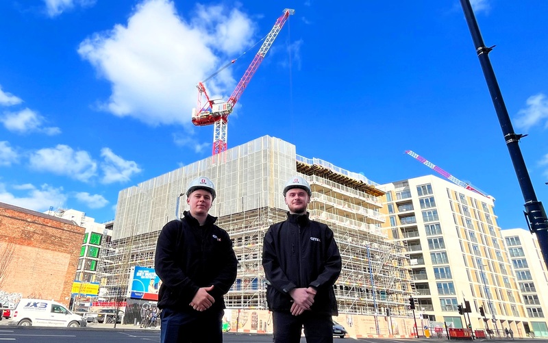 GMI apprentices Liam Jones (left), Assistant Site Manager and Cain Williams, Assistant Site Engineer, at the New Cross development in Manchester city centre