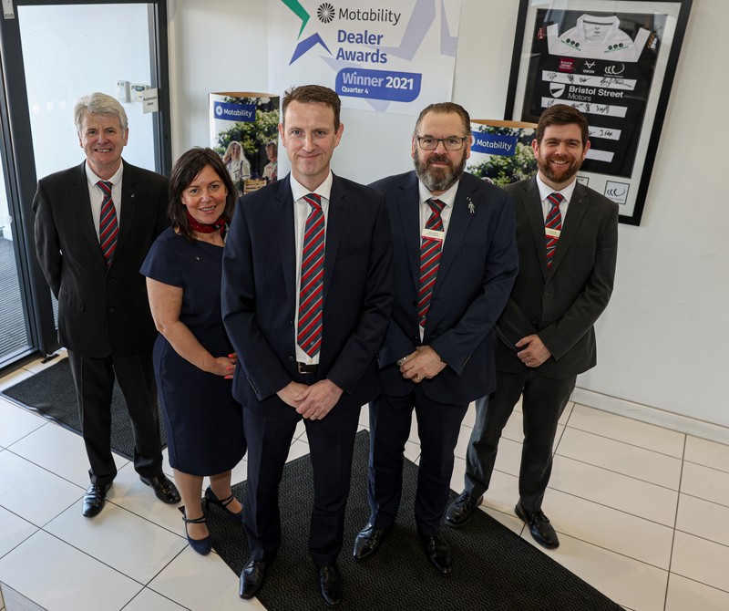 L-R Philip Hawkins (Motability specialist), Tracey Taylforth (group Motability manager), Marc Prince, Andre Pieters and Andy Ling from Bristol Street Motors Widnes Nissan