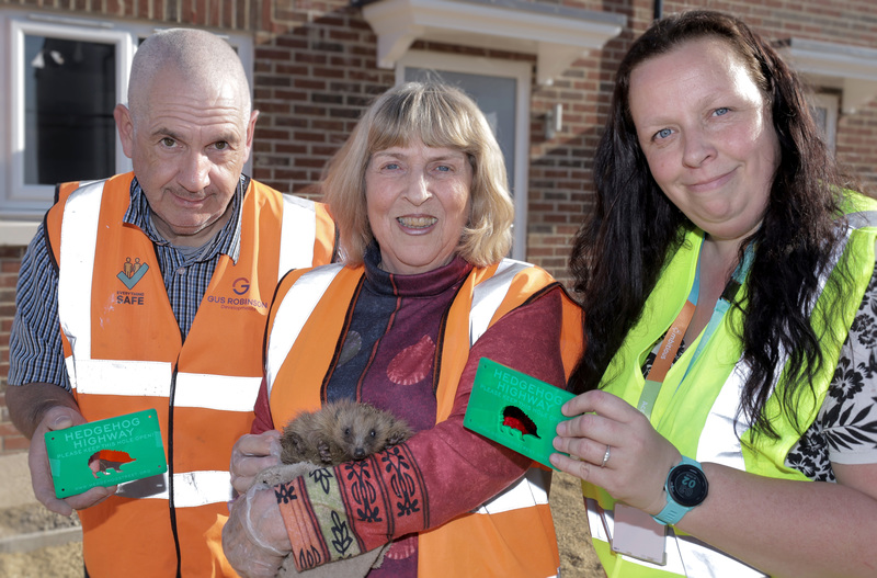 Beyond Housing Assistant Project Manager Elaine Dance (right) pictured with (from left) Gus Robinson Developments Site Manager Barry Atkinson and Cllr and hedgehog expert Anne Watts with one of her rescued hedgehogs 