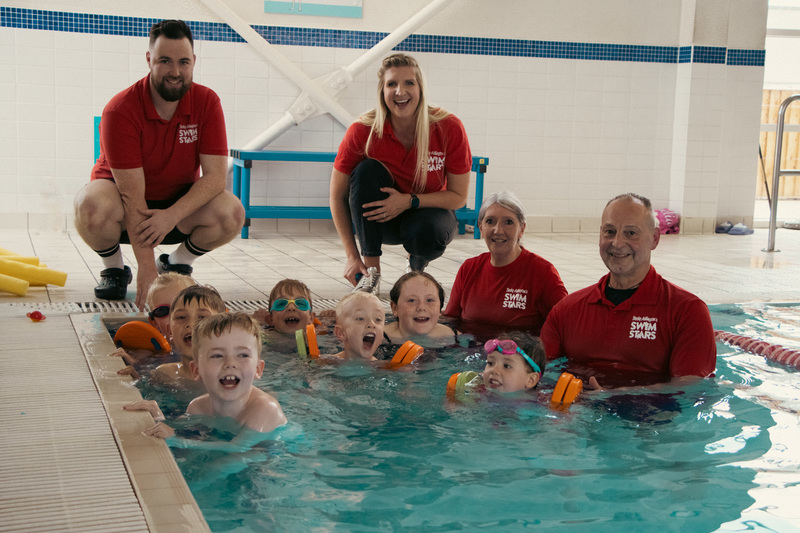 Becky Adlington with some of the SwimStars instructors and children 