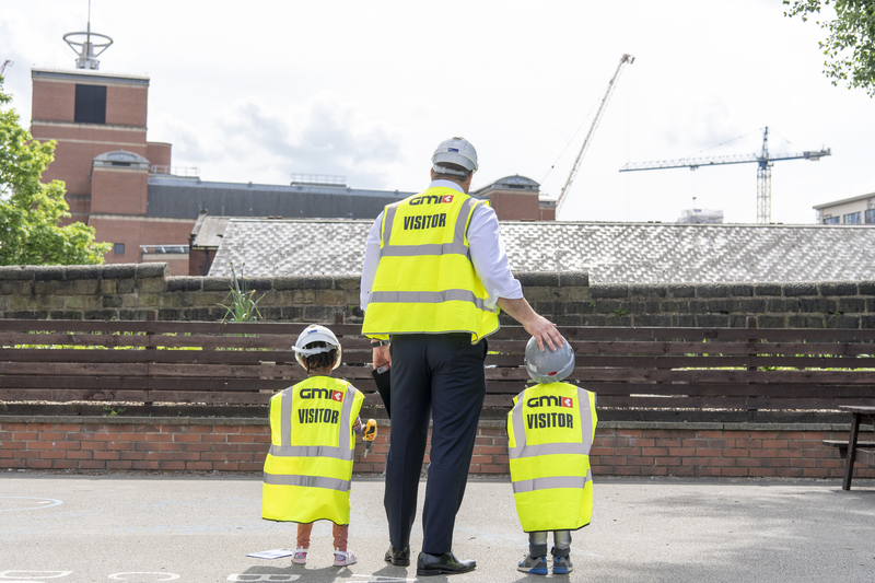 Lee Powell, GMI’s Chief Executive Officer, joins pupils at Brooklands School in a construction-themed play session