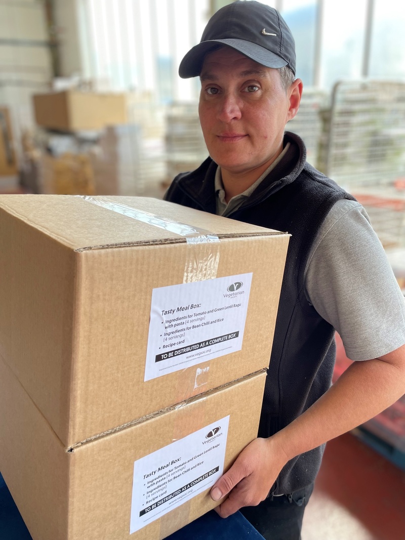 Kaz Brown, team leader at MCR Services with some of the completed Vegetarian Society meal boxes bound for independent food banks on the Isle of Bute