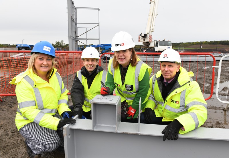 Durham City MP Mary Kelly Foy signs one of the first steel beams to arrive at the Connect site, with Julie Raistrick, James Taylor, Regional Director, Citrus Group, and Gary Oates