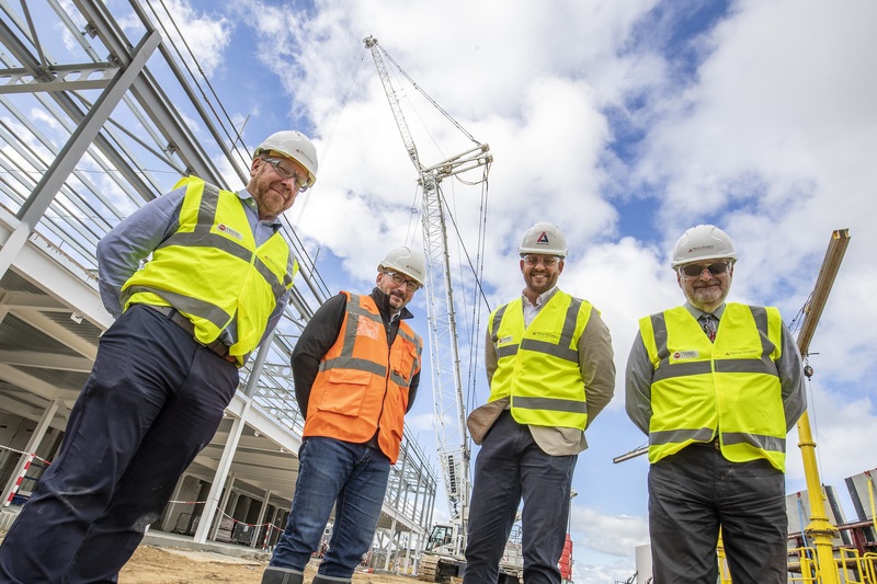 Left to right: Tim Shepherd (Project Director, Tilbury Douglas), Eddie Wooton (Project Manager, Tilbury Douglas), Dean Cook (Managing Director, Arlington Real Estate) and Dept Police and Crime Commissioner Nigel Bryson in front of the 75m high crane
