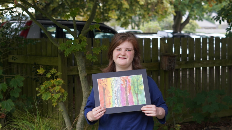 Isabelle with her artwork 