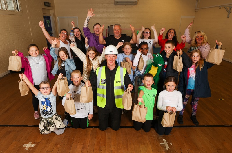 GMI Assistant Site Manager Jack Dickinson (front, centre) with supporters, including committee member Gary Hutchinson (back, centre) and members of Bowburn Youth Project with some of the packed lunches it supplies