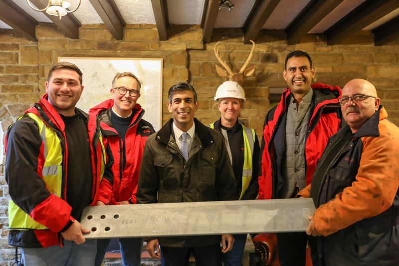 left to right Adam Ramsden safety adviser, David John director of sites, Rishi Sunak MP, Penny Holland project manager, Shuja Khan chief executive Arqiva, Billy Wilkinson rigger with a piece of steel signed by Mr Sunak to be used in the mast construction