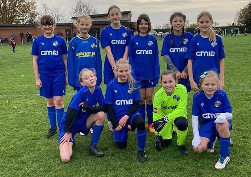  Goalkeeper Sophie (front, second right) with her Brayton Belles Under 11s teammates