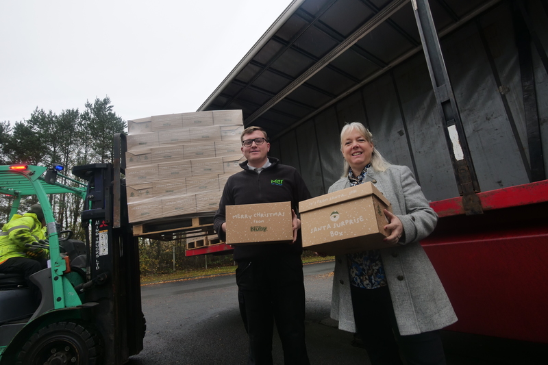 Matthew Fretwell and Caroline Moody watch as the Santa Surprises boxes are prepared for distribution in time for Christmas