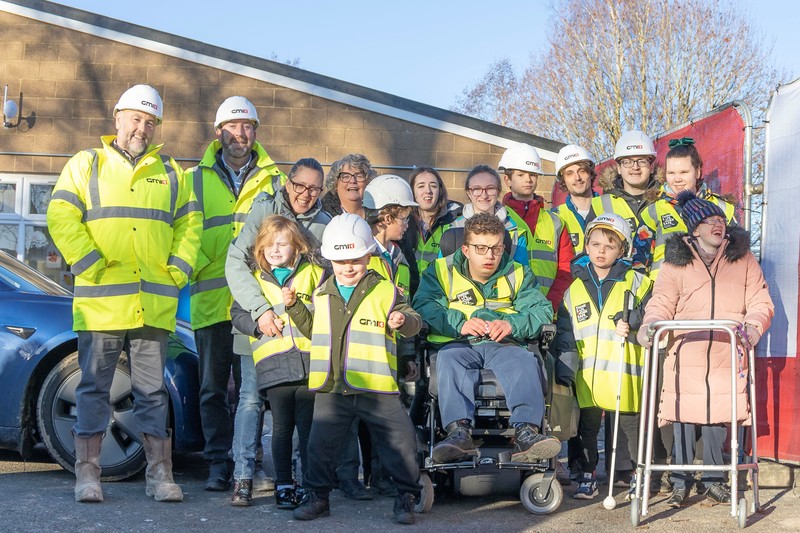 Contracts Manager Adrian Kelly and Project Manager Steve Dwan of GMI Construction Group pictured with staff and pupils at Skipton’s Brooklands School where work is underway on a new Rebound Therapy building