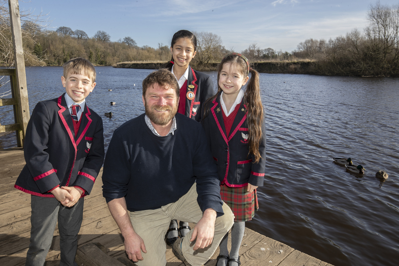 Ben Lamb, CEO at the Tees River Trust, pictured with Yarm school pupils on the banks of the Tees