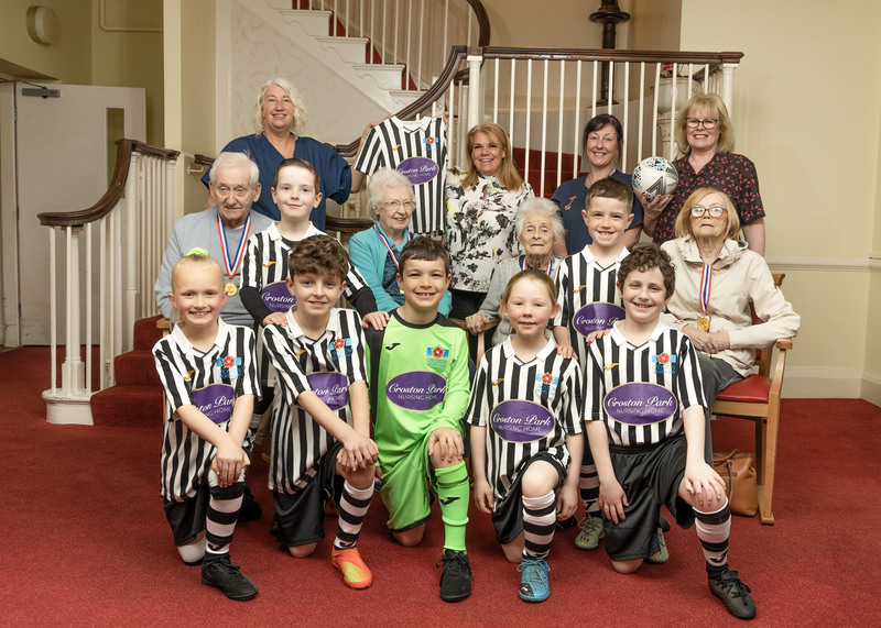 Croston players pictured with staff and residents at the home 