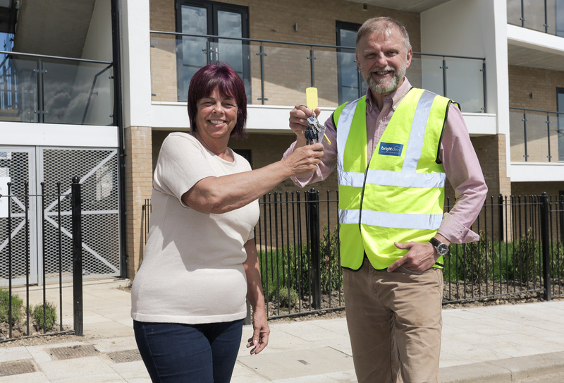 Beyond Housing Sales Coordinator Vicky Griffiths (left) takes handover of the new Boho apartments from Bright Ideas MD Martin Hawthorne 