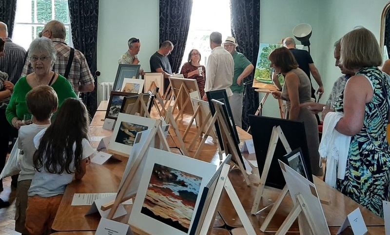 Barbara (left) mingles with those attending her surprise art exhibition at The Manor House in Sedgefield