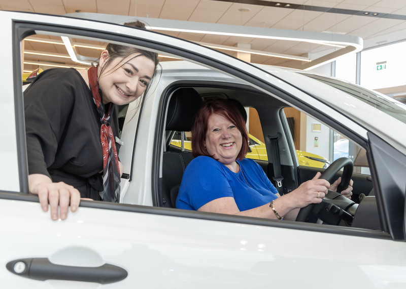 Sophie Burch, New Car Sales Manager at Vertu Kia Nottingham with winner Sue Bellis