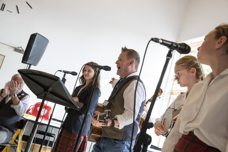 Mike McGrother (centre) performing alongside students at Yarm School  