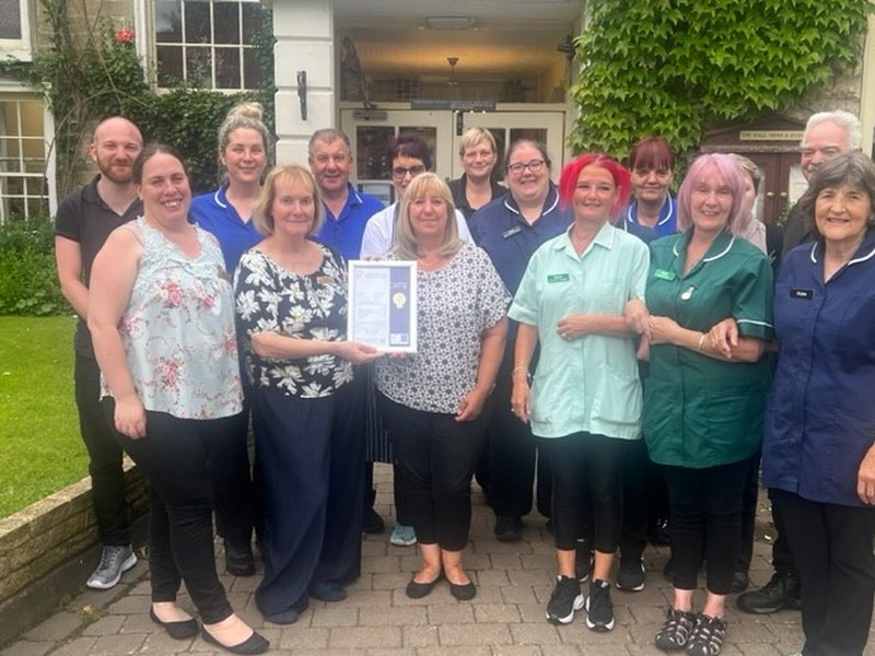 Members of staff at The Hall pictured with the CIUK certificate 