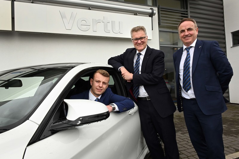 Flynn Elliott (in car) with Robert Forrester, Chief Executive of Vertu Motors and Anthony Masterson Operations Director for Vertu Motors BMW & MINI